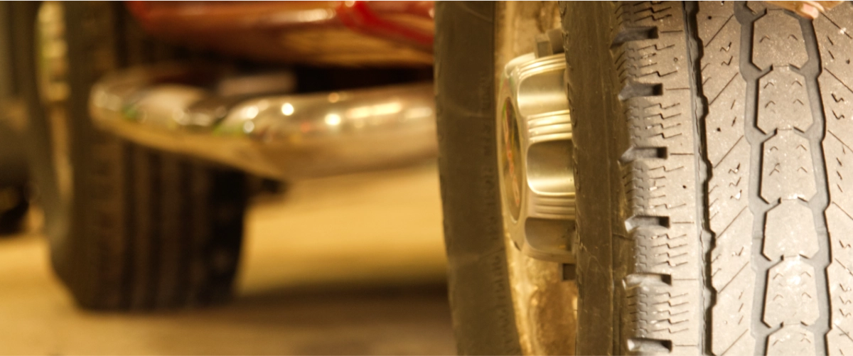 A low angle of car tires on a car